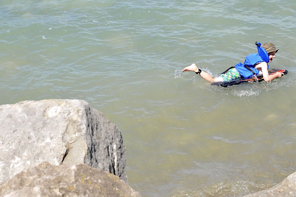 A photo of a boy swimming.